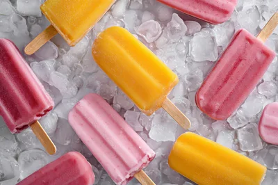 Assorted Fruit Popsicles On A Bed Of Ice