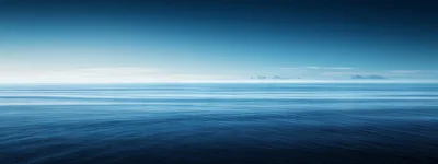Calm Blue Ocean Horizon Under Clear Sky