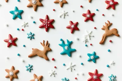 Christmas Gingerbread Cookies and Sprinkles on White Background
