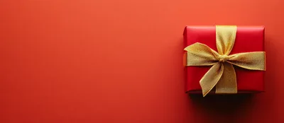 Red Gift Box With Gold Ribbon On Red Background