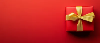 Red Gift Box With Gold Ribbon On Red Background