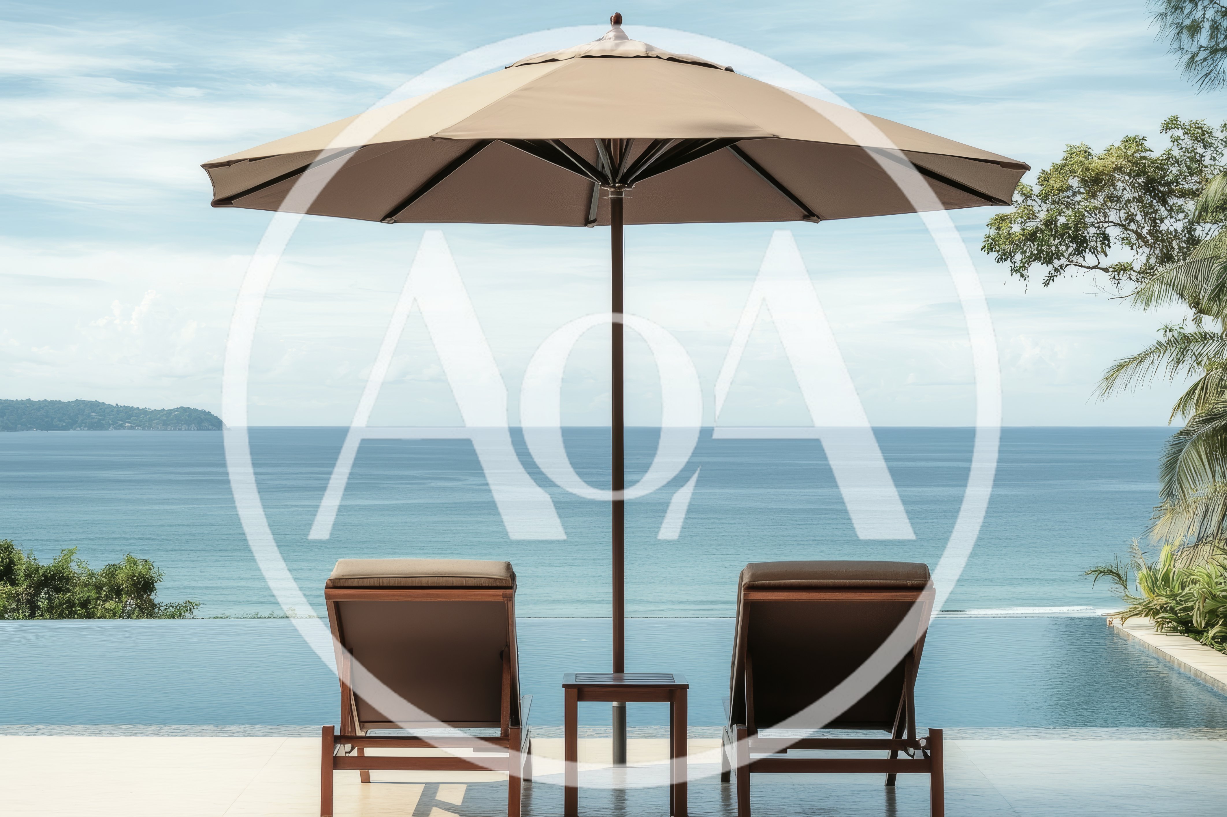 Two Lounge Chairs Under Umbrella Overlooking Tropical Ocean