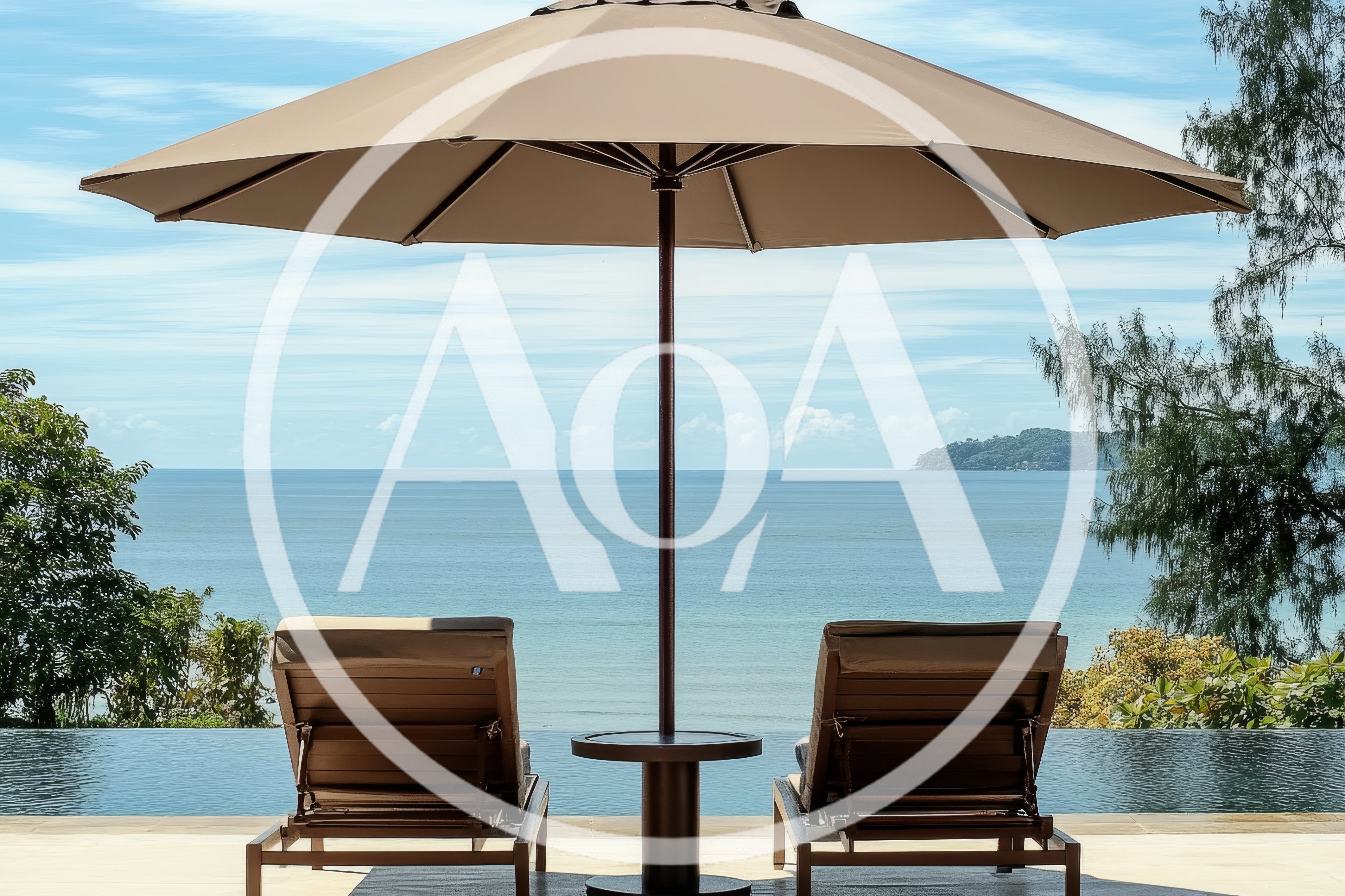 Two Sun Loungers By An Infinity Pool Overlooking The Ocean