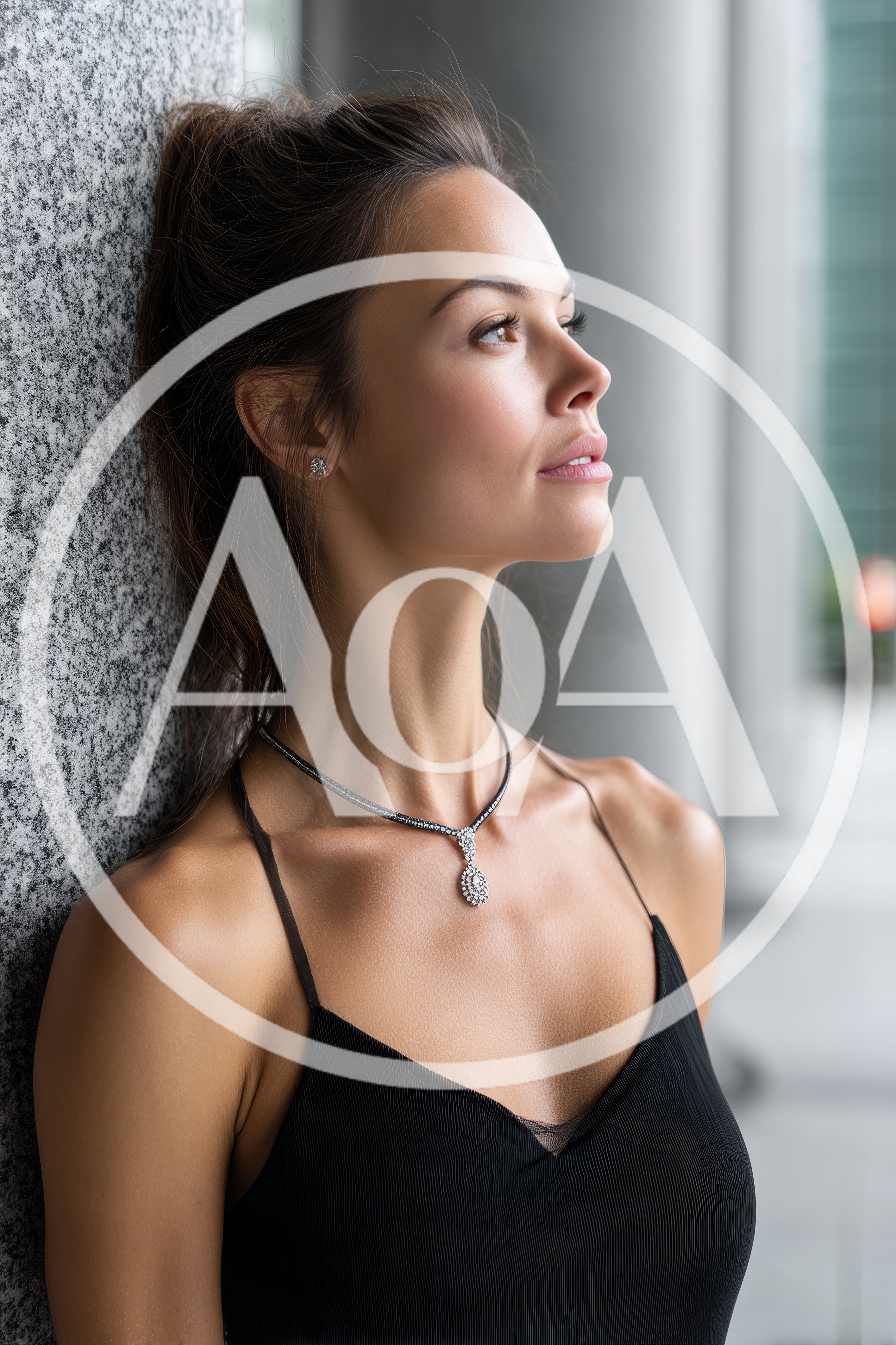 Elegant Woman Leaning Against A Granite Pillar