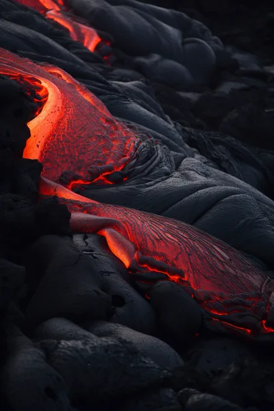 Molten Lava Flowing Over Volcanic Rock