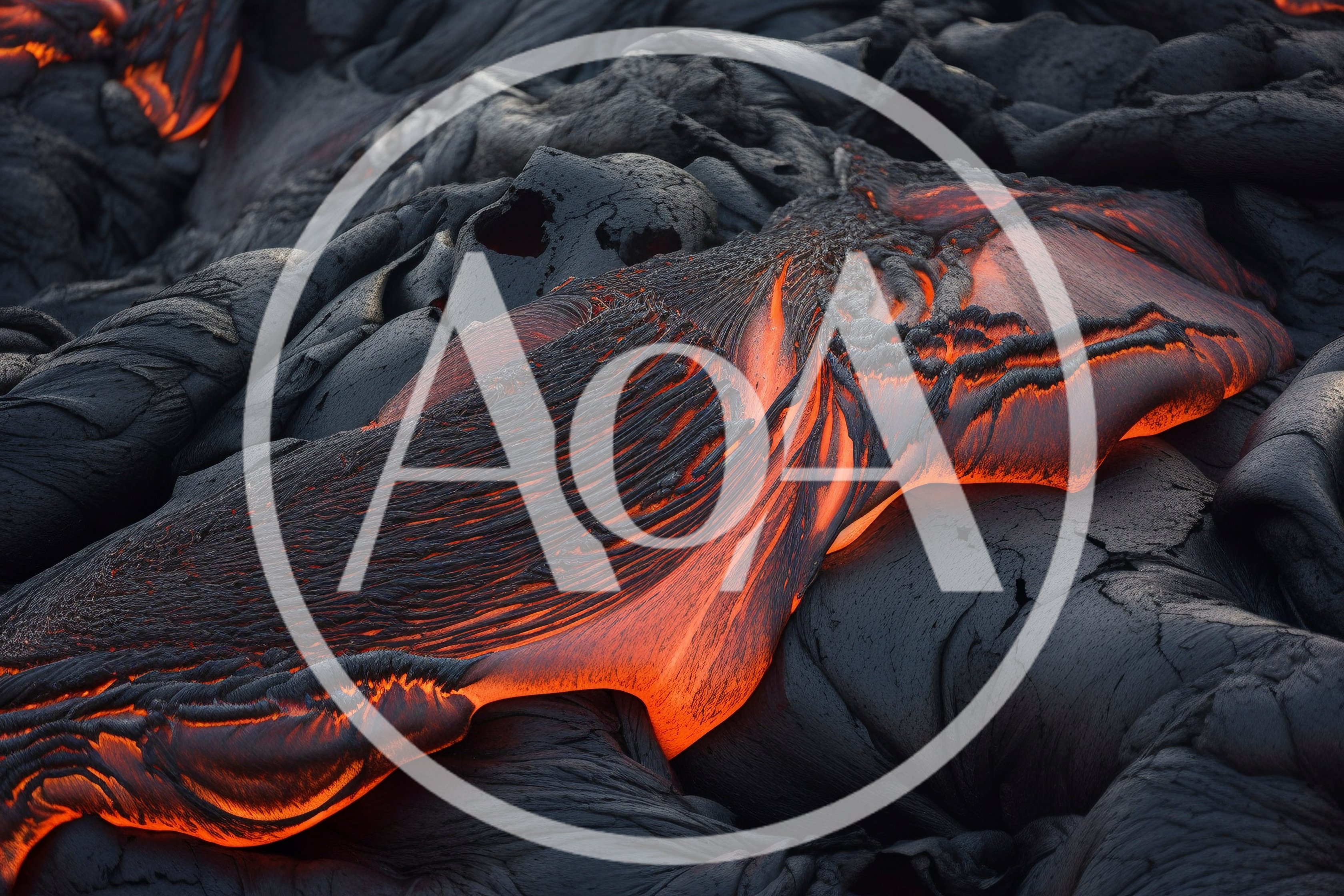 Molten Lava Flowing Over Hardened Volcanic Rock