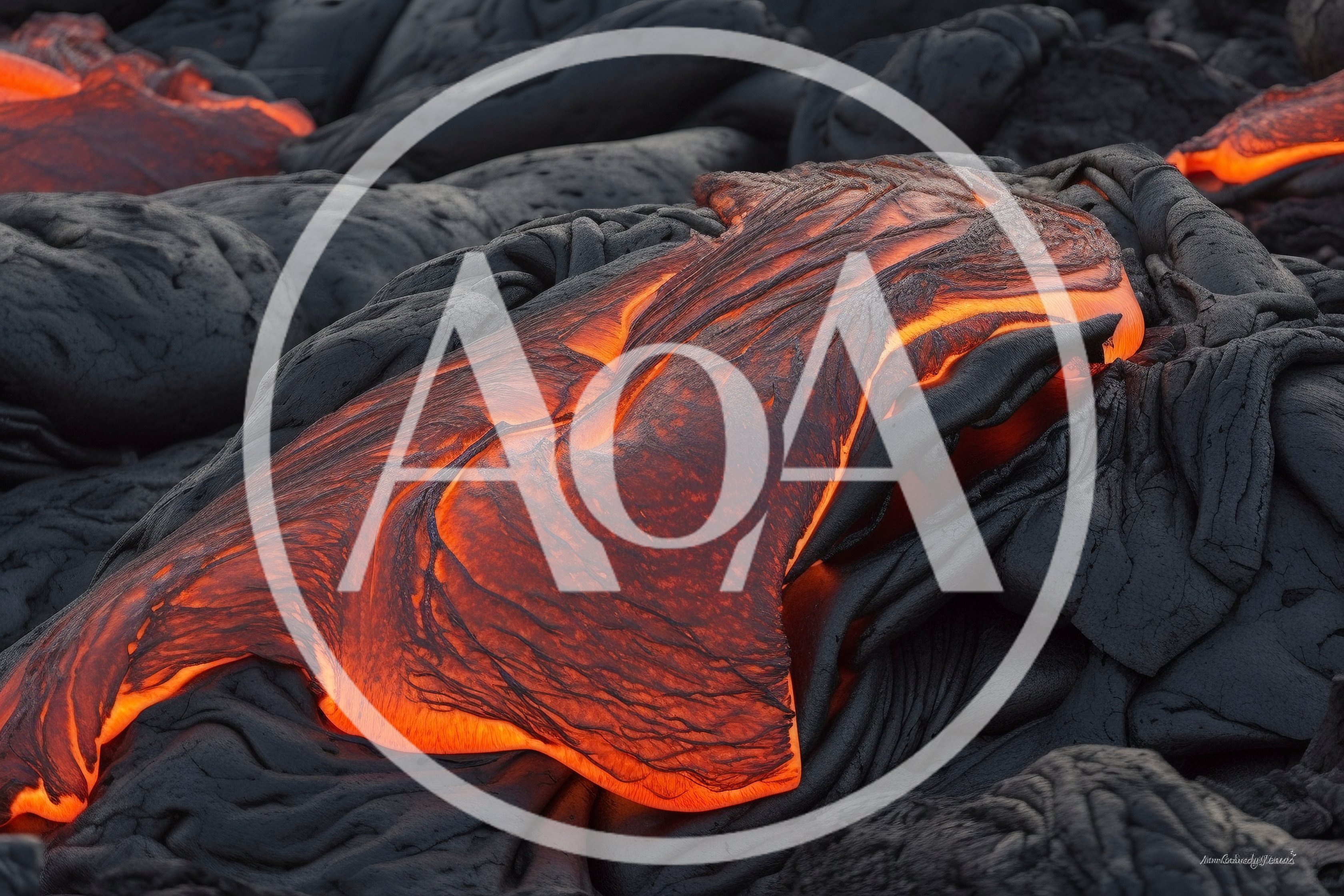Molten Lava Flowing Over Hardened Volcanic Rock