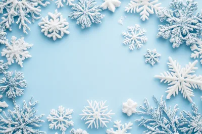 Decorative White Snowflakes On Light Blue Background