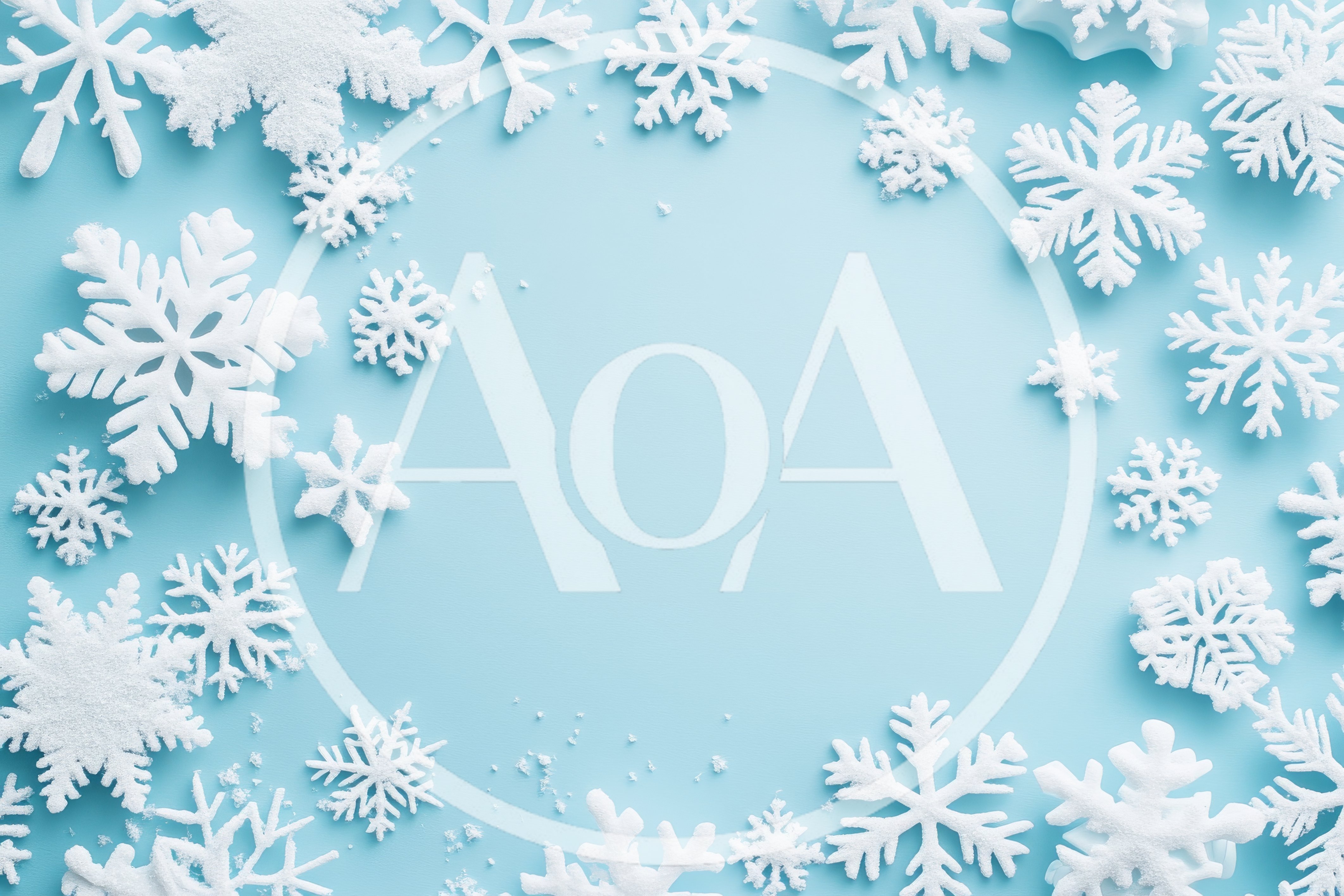 White Snowflake Ornaments Arranged on Light Blue Background