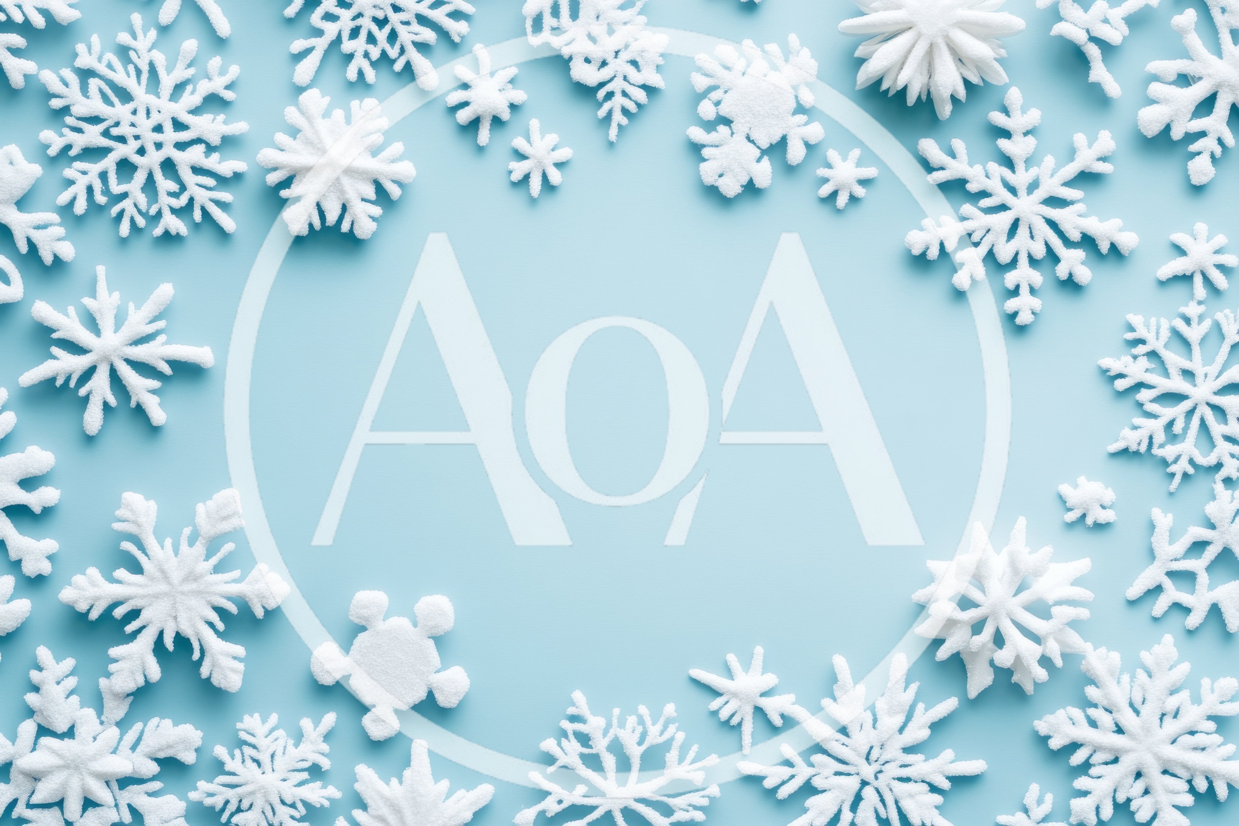 White Snowflake Ornaments Arranged On Light Blue Background