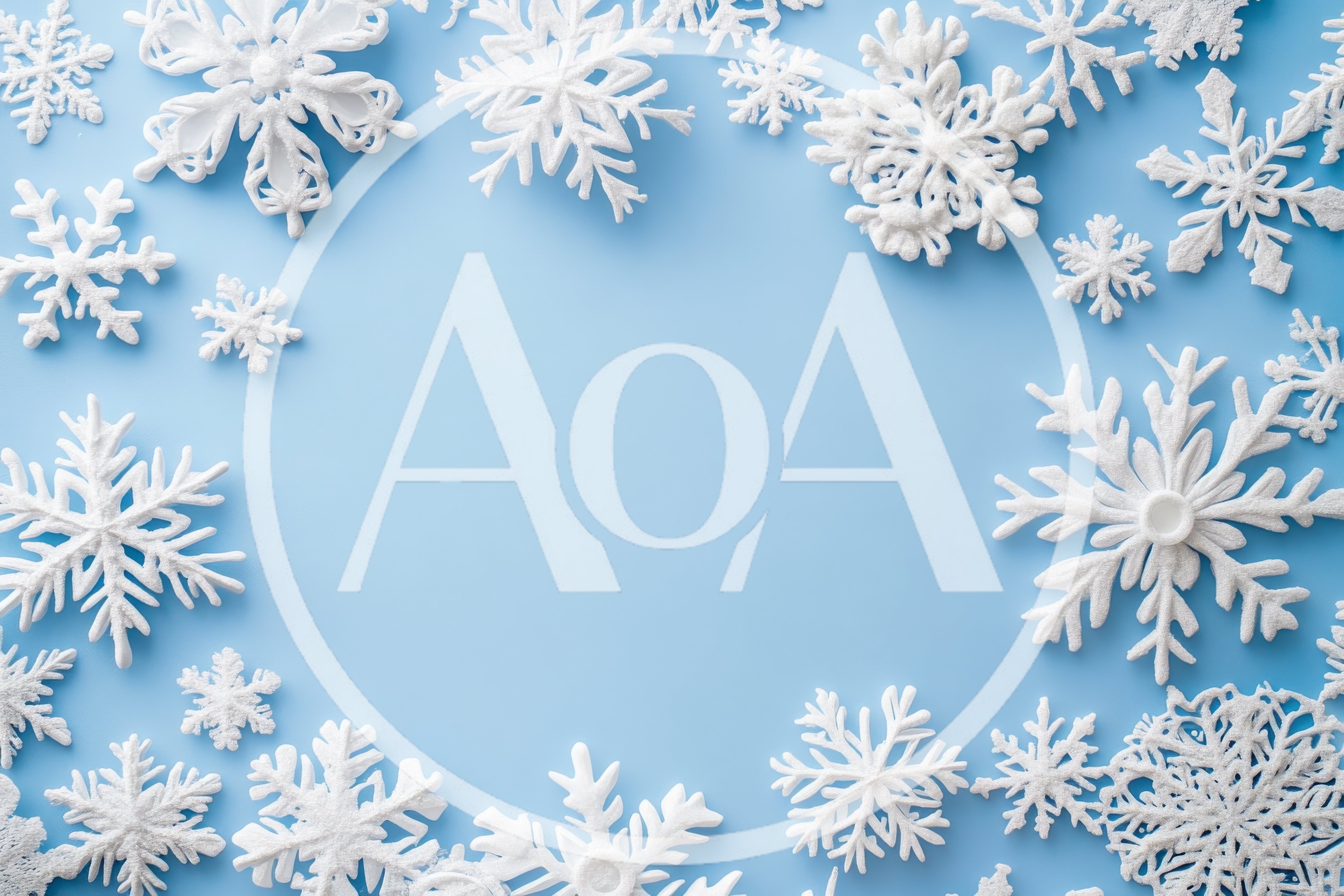 White Snowflake Ornaments Arranged on Light Blue Background