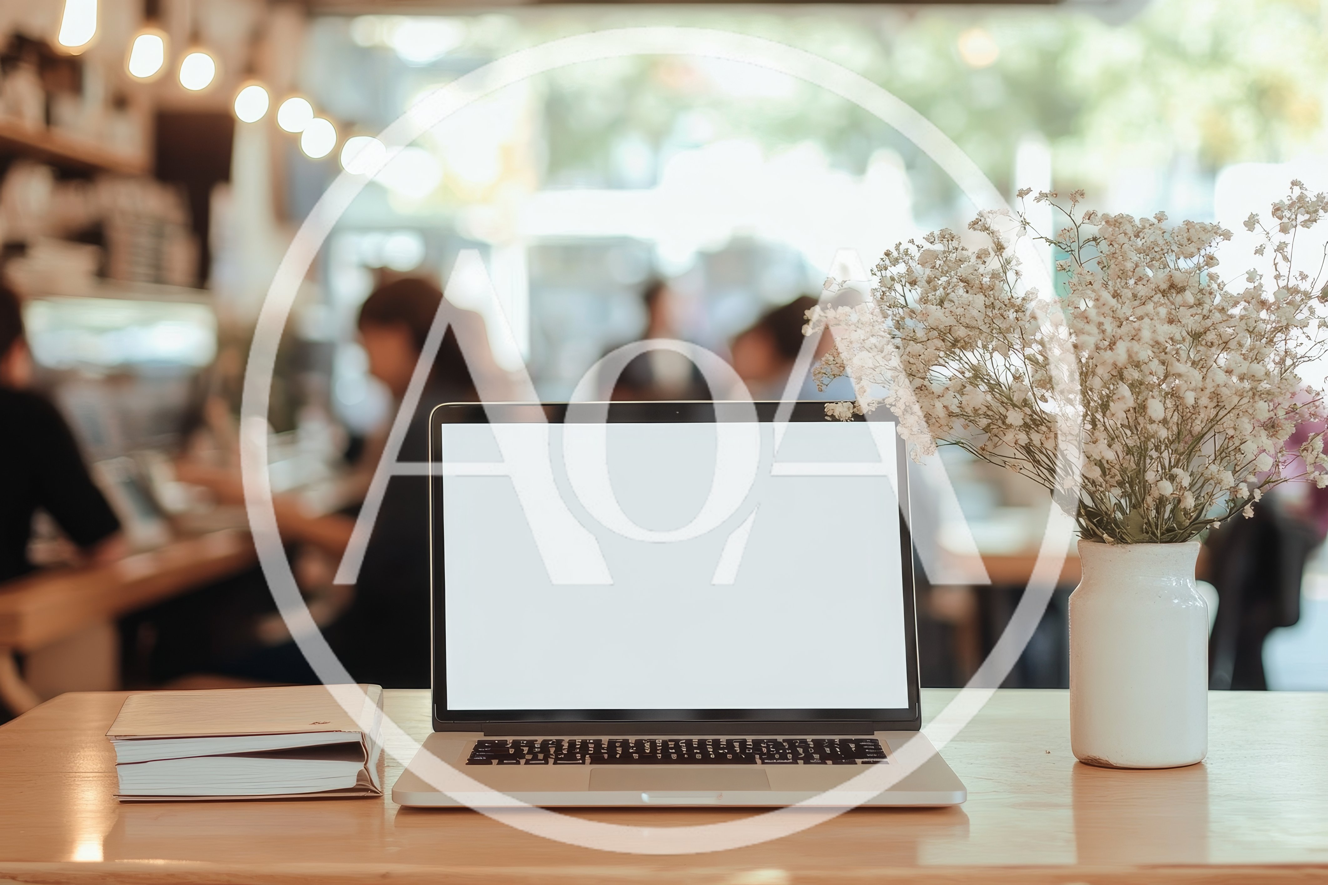 Laptop With Blank Screen On Cafe Table