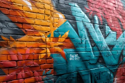 Vibrant Abstract Graffiti Mural On Brick Wall