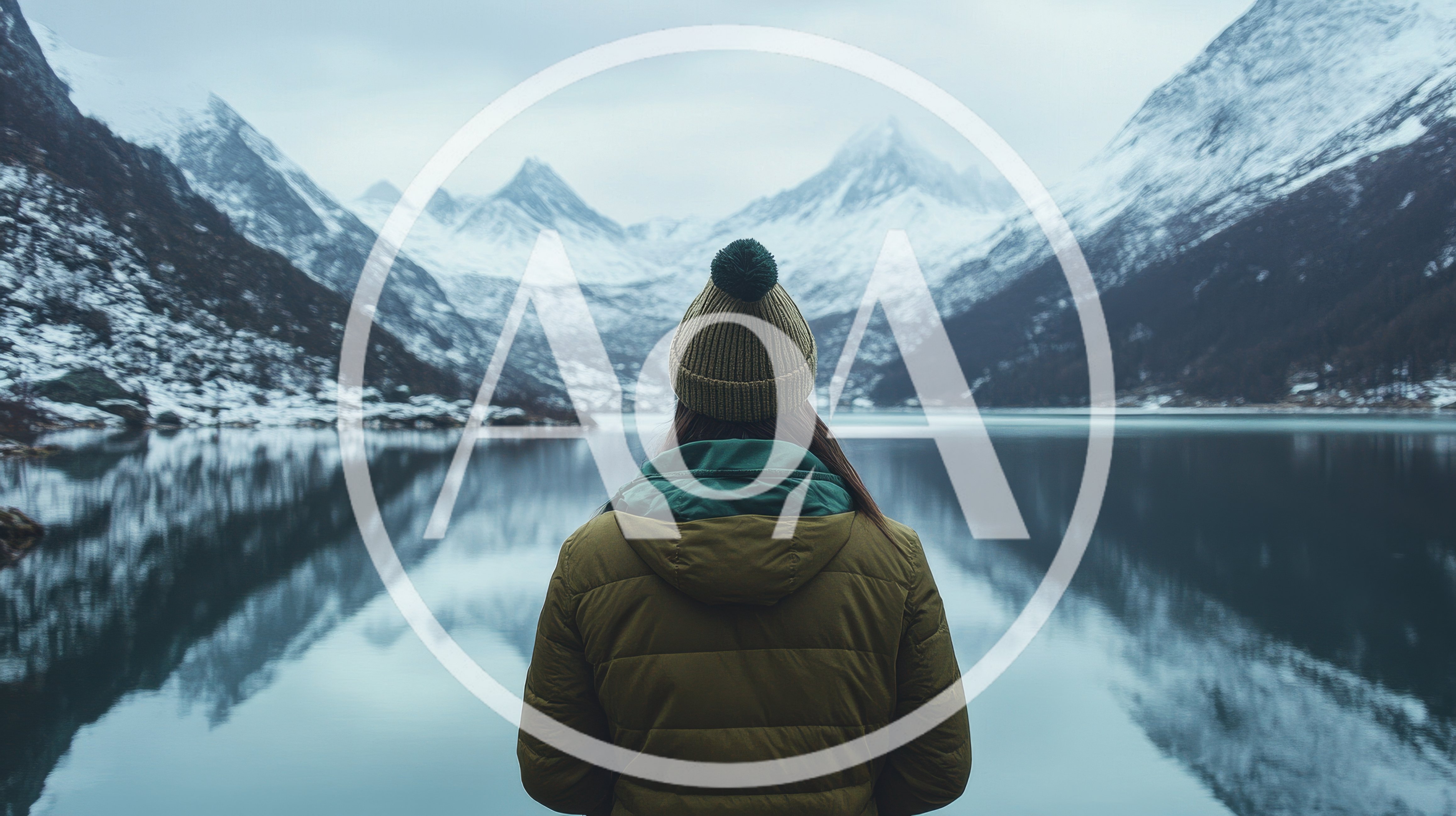 Woman Standing Before A Snowy Mountain Lake