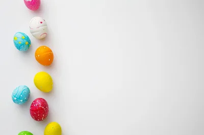 Colorful Easter Eggs Arranged On White Background