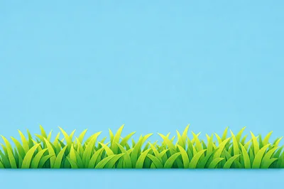 Green Grass Blades Against A Solid Blue Background