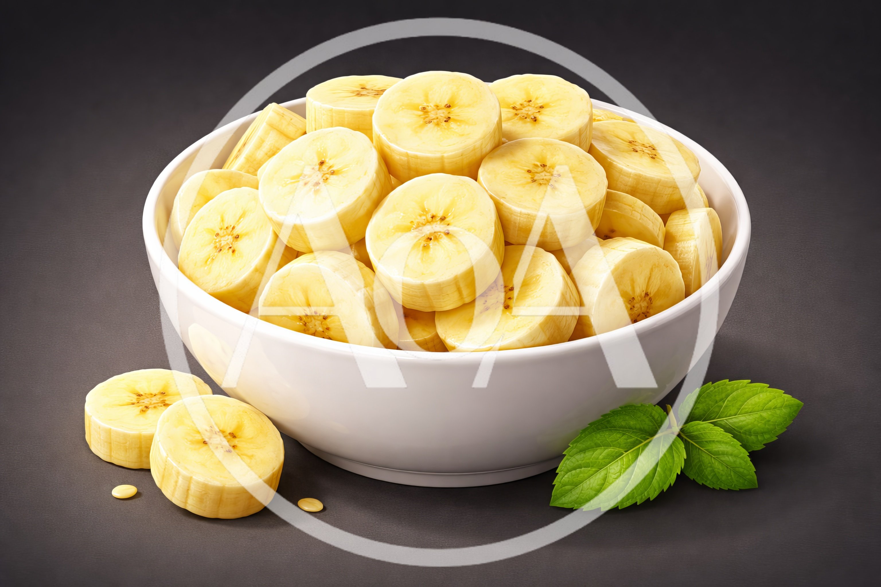 Fresh Banana Slices In A White Bowl