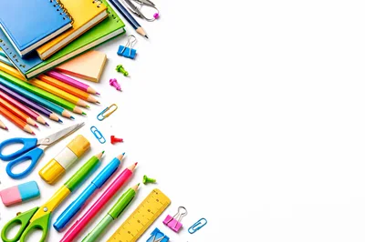 Assorted School Supplies Arranged on White Background