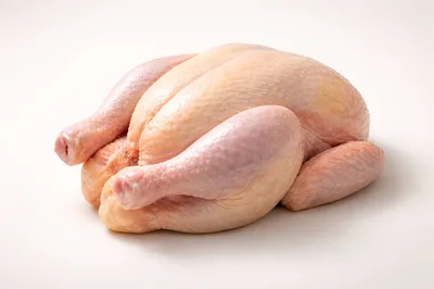 Raw Whole Chicken On White Background