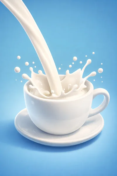 Milk Pouring Into A White Ceramic Cup