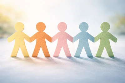 Five Colorful Paper Cutout Figures Holding Hands