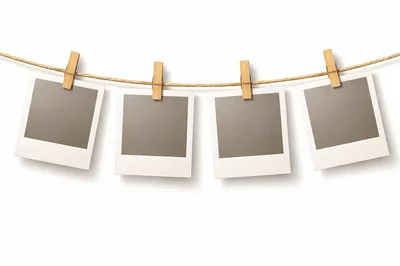 Four Blank Polaroid Frames Hanging On A Clothesline