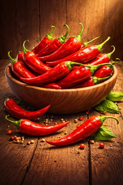 Fresh Red Chili Peppers in Wooden Bowl