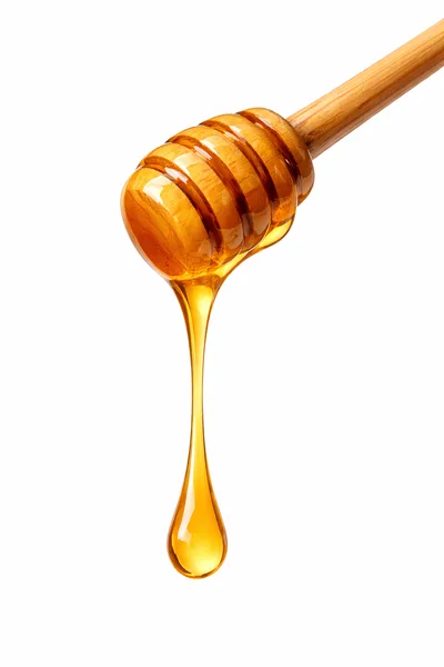 Honey Dripping From A Wooden Honey Dipper