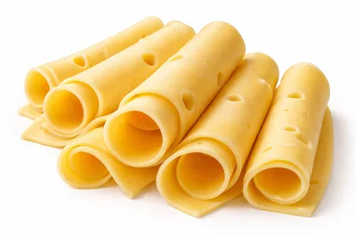 Rolled Slices Of Swiss Cheese On White Background