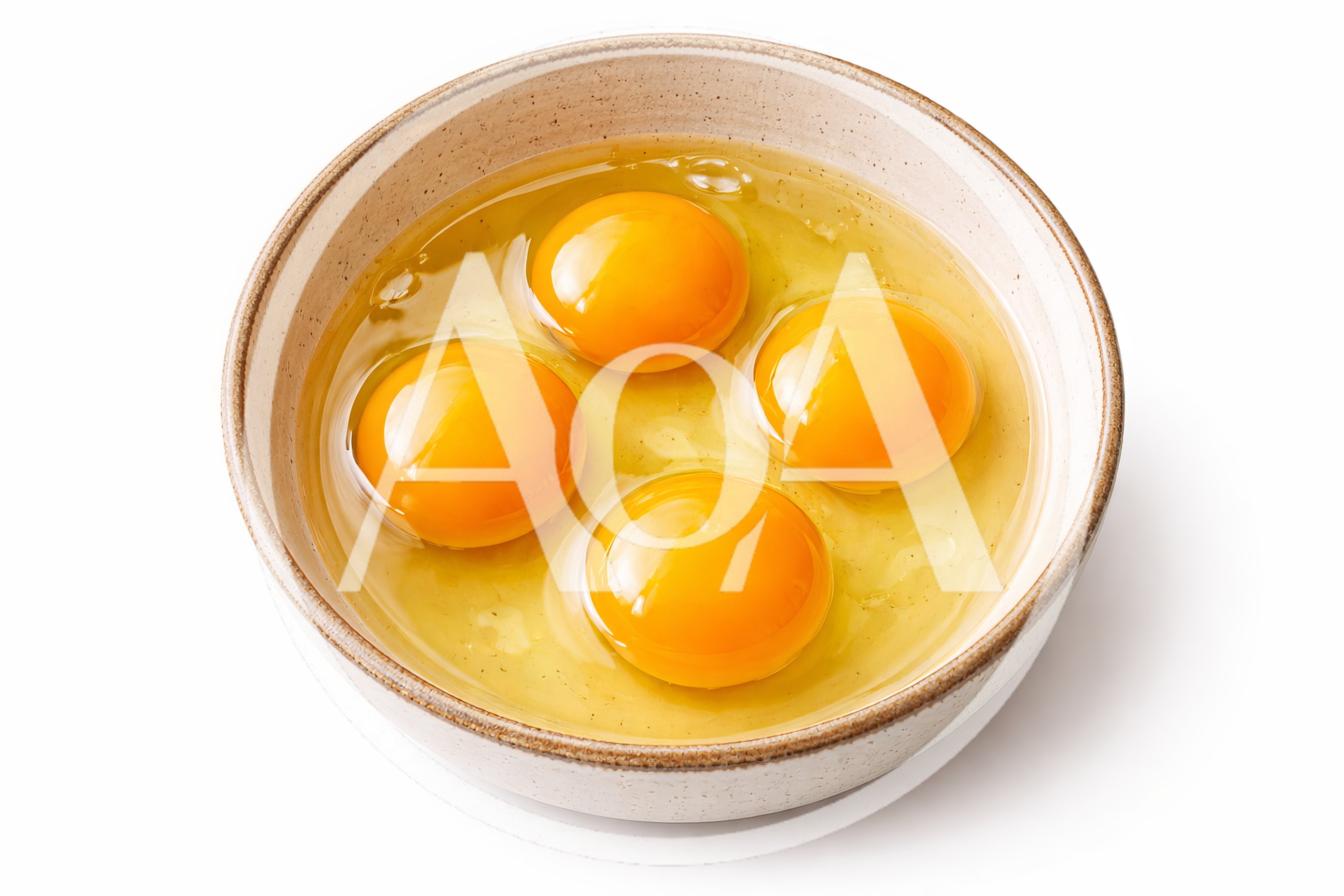 Four Raw Egg Yolks In A Ceramic Bowl