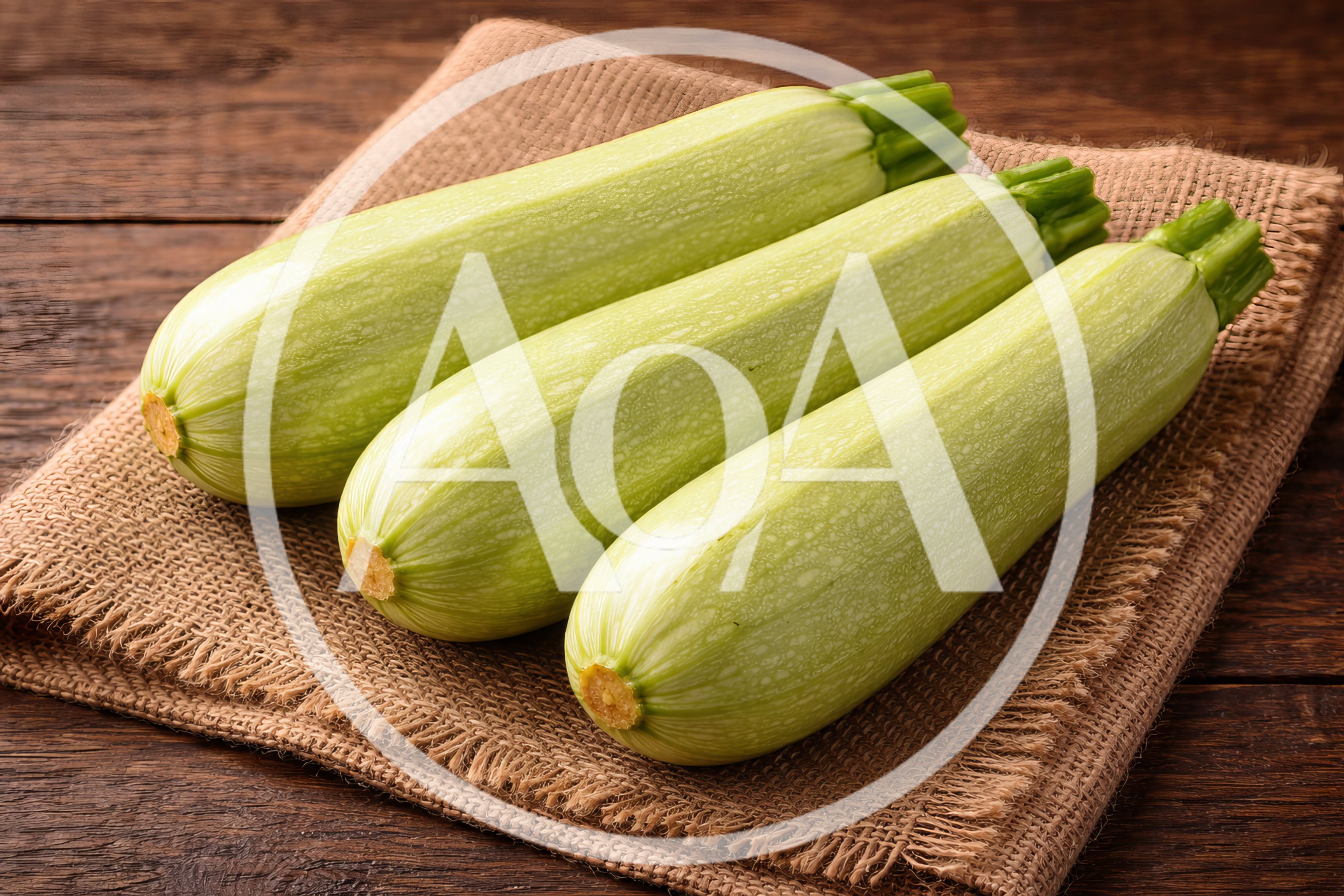 Three Fresh Zucchini Squashes on Burlap