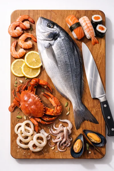 Fresh Seafood Assortment on Wooden Cutting Board