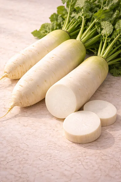 Fresh Daikon Radishes With Green Leaves On Marble