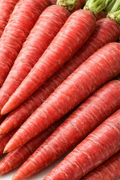 Fresh Organic Red Carrots Stacked Together