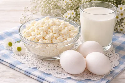 Cottage Cheese Milk and Eggs on Rustic Table