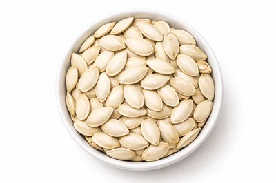 Top View Of Pumpkin Seeds In White Bowl