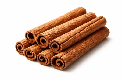 Stack Of Aromatic Cinnamon Sticks On White Background