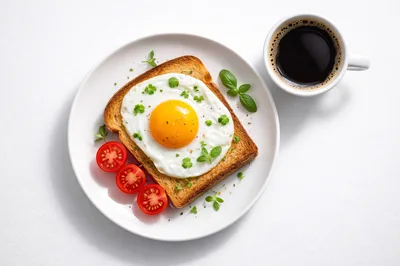Fried Egg On Toast With Tomatoes And Coffee