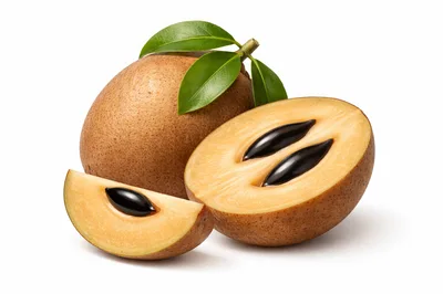 Whole and Sliced Sapodilla Fruit with Leaves
