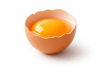 Broken Brown Egg With Raw Yolk