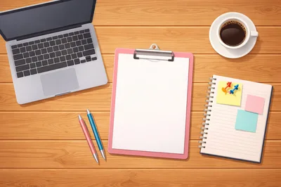 Top View Of Office Desk With Laptop And Stationery