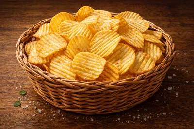 Woven Basket Filled With Crispy Ruffled Potato Chips