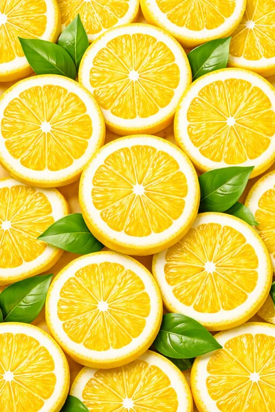 Fresh Lemon Slices With Green Leaves Background