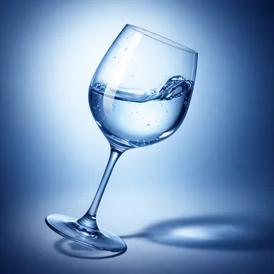 Tilted Wine Glass Filled With Clear Water