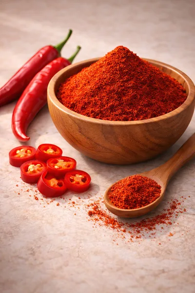 Wooden Bowl And Spoon With Red Chili Powder