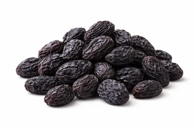 Pile of Dried Black Raisins on White Background