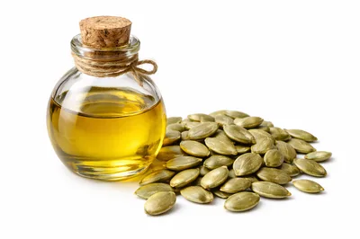 Pumpkin Seed Oil in Glass Bottle with Seeds