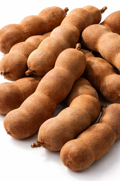 Fresh Tamarind Pods Arranged On White Background