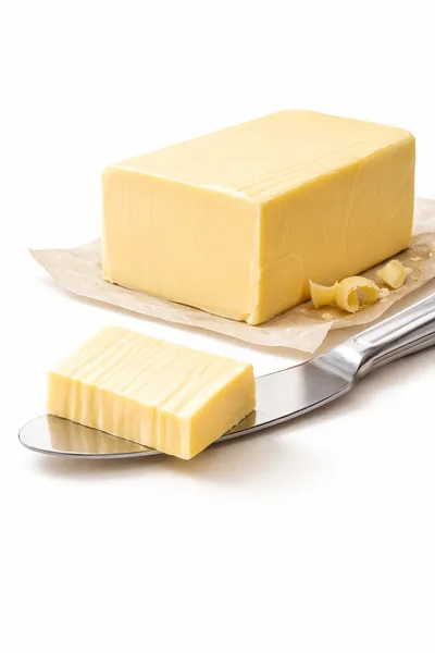 Block Of Butter With A Slice On A Knife