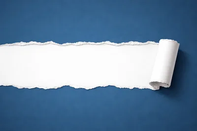 Torn Blue Paper With Rolled Edge